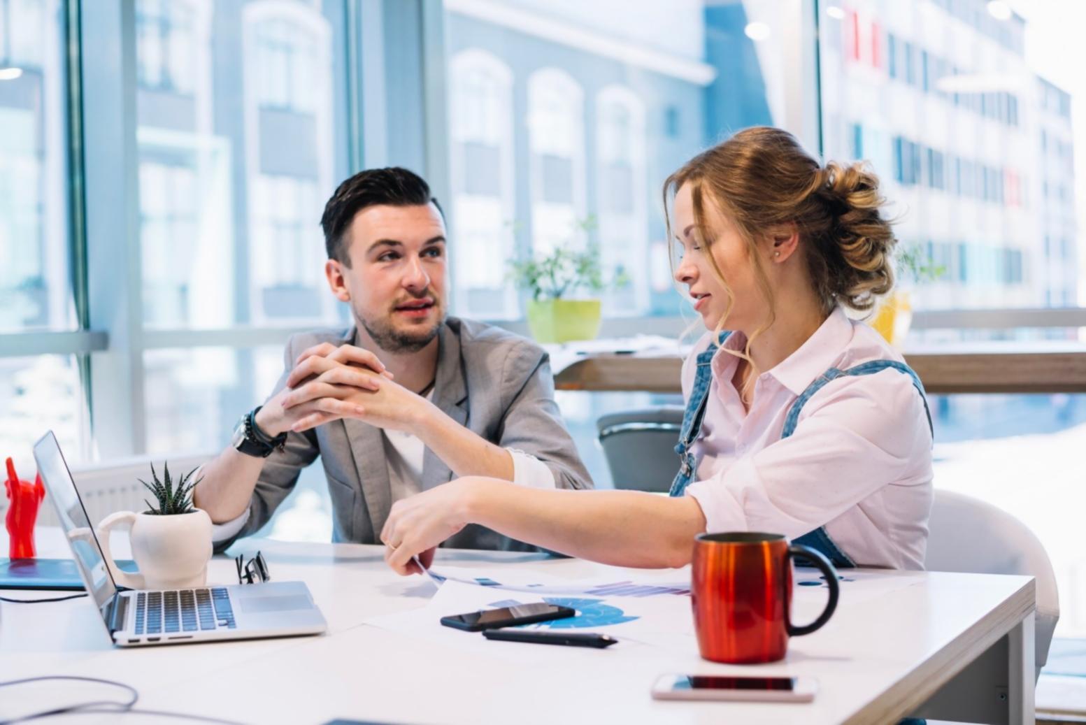 Group of people engaged in financial literacy discussion at community education event